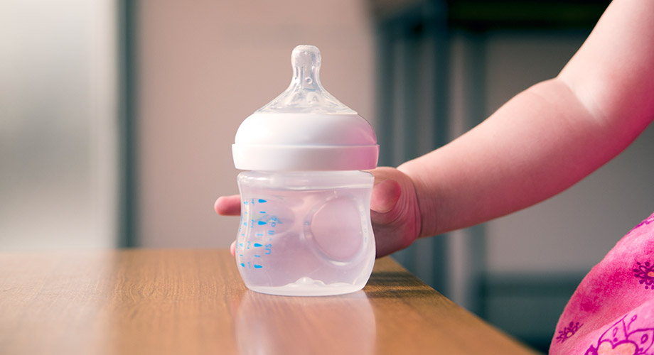 Baby Hand on Beaker
