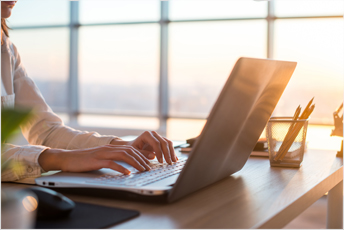 Business woman working at home with computer